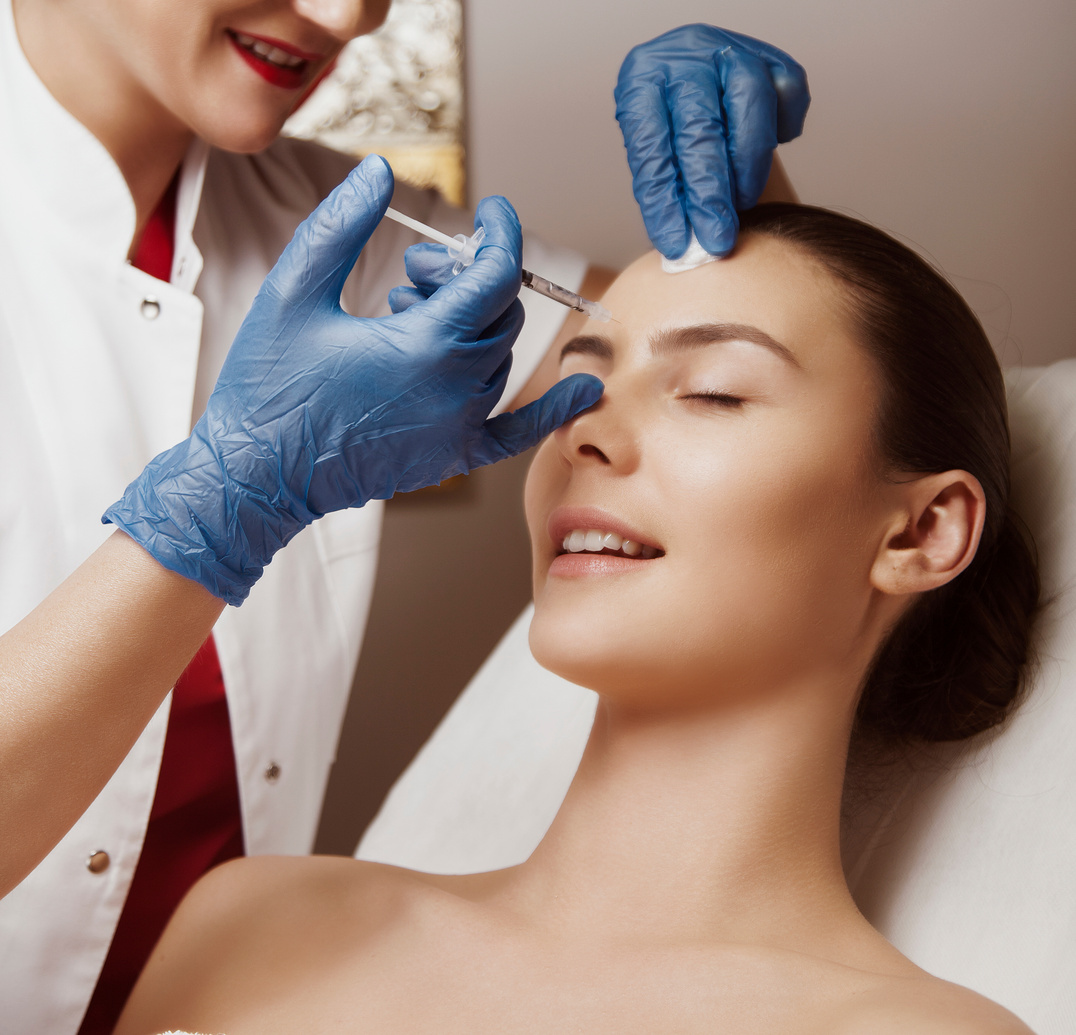Dermatologist doctor doing botox treatment to her patient